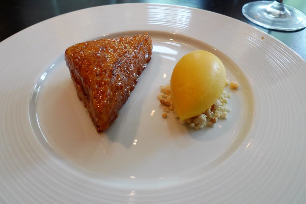 An elegant plated dessert in a fine dining restaurant