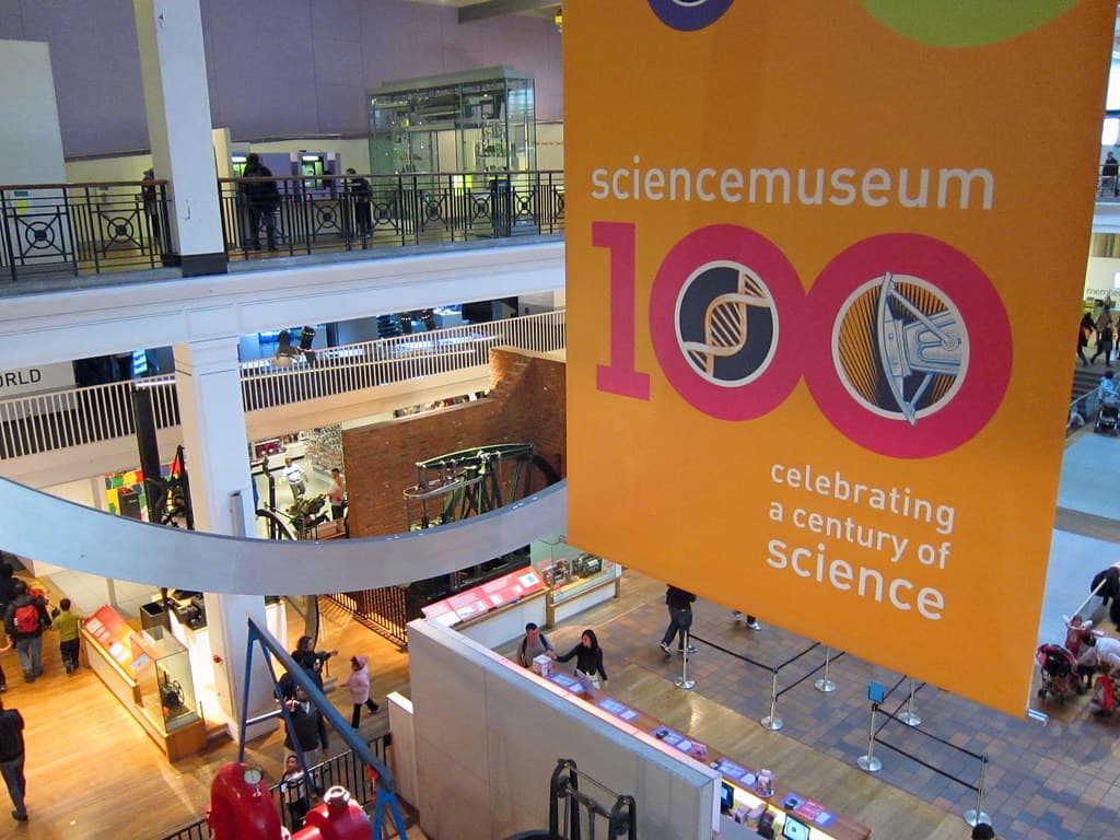 Visitors looking at exhibits in a science museum gallery