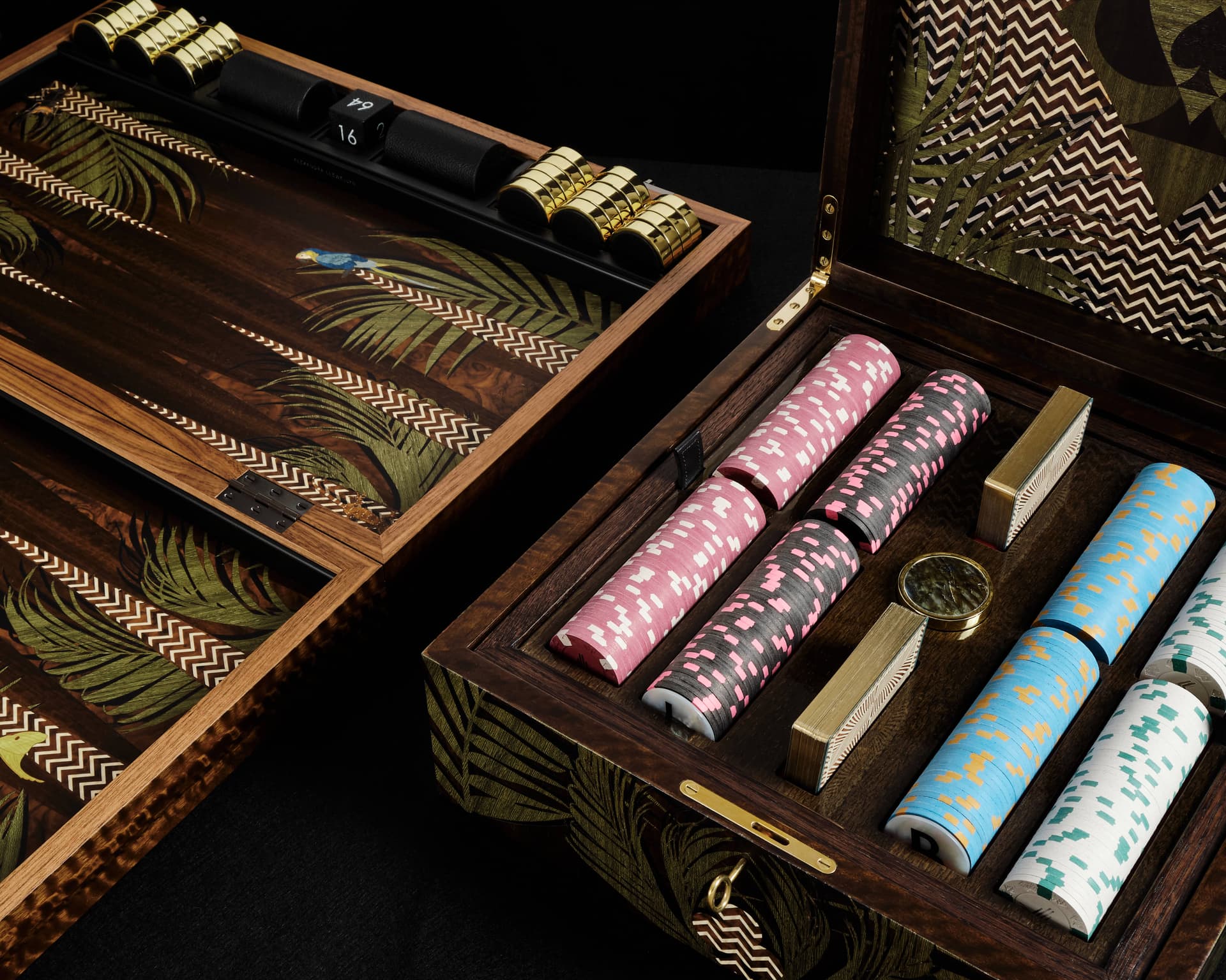 A beautifully inlaid wooden backgammon board with dice on a dark table
