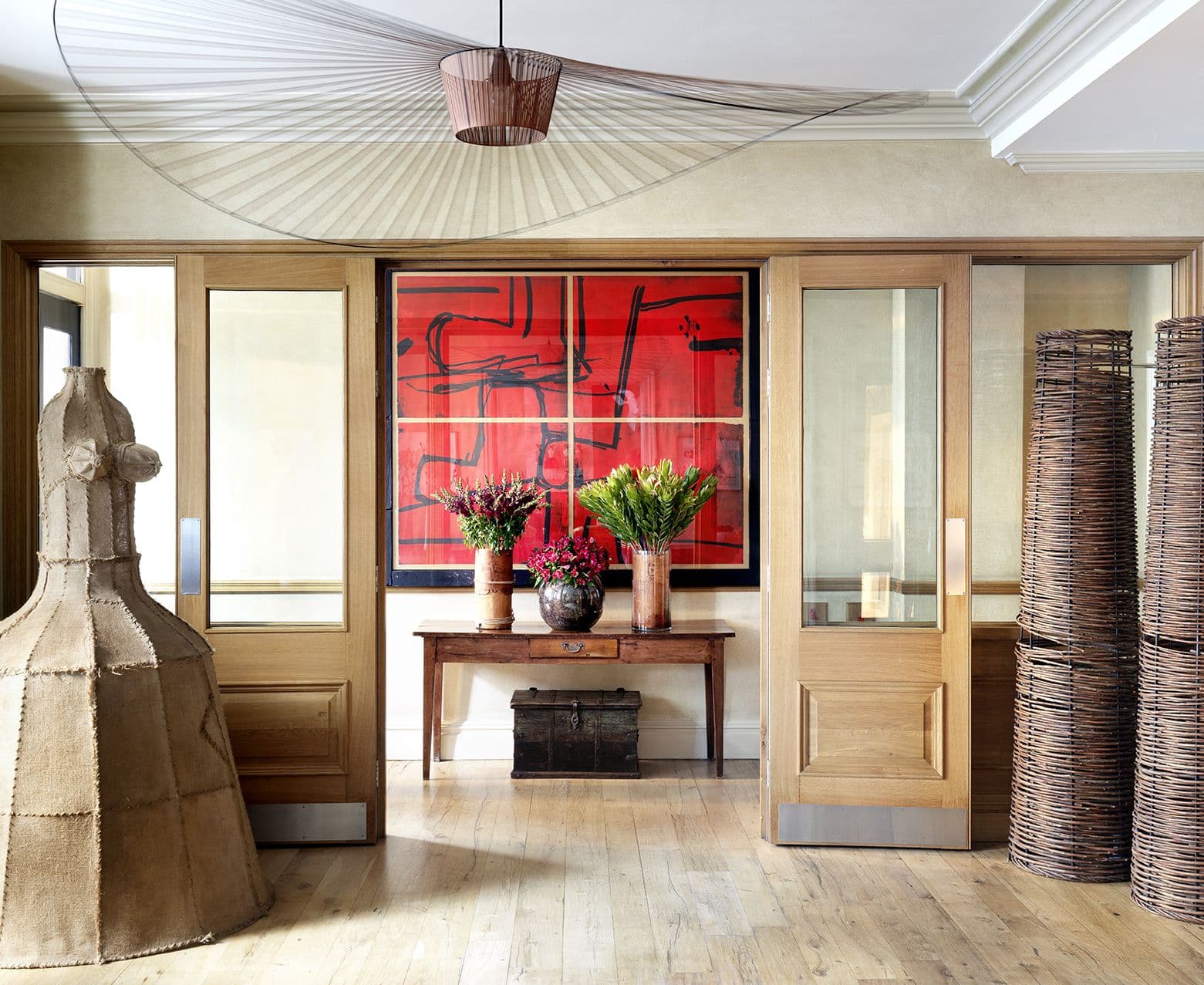 A cosy townhouse hotel drawing room with a fireplace and armchairs